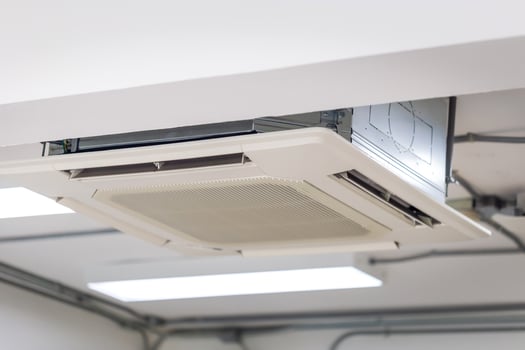 Modern ceiling mounted cassette type air conditioning system in coffee shop photo