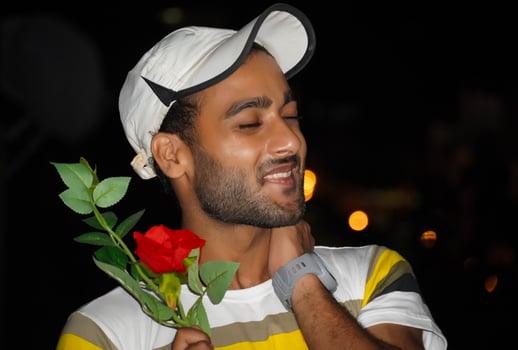 a boy with rose going to Propose his lover and exited photo