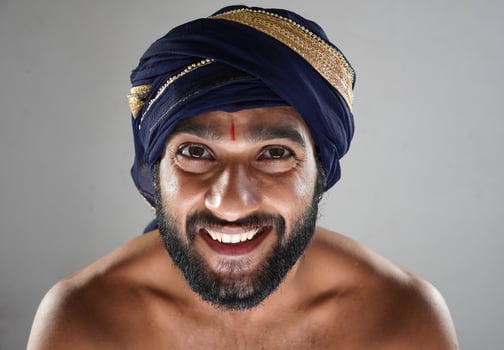hindu king smiliing king images - indian man in Theater acting as a king photo