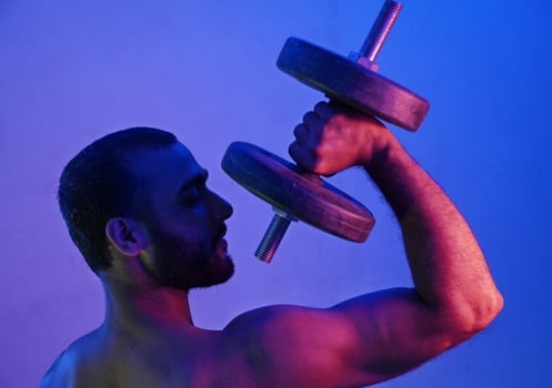 Dumbbell Man in night light photo