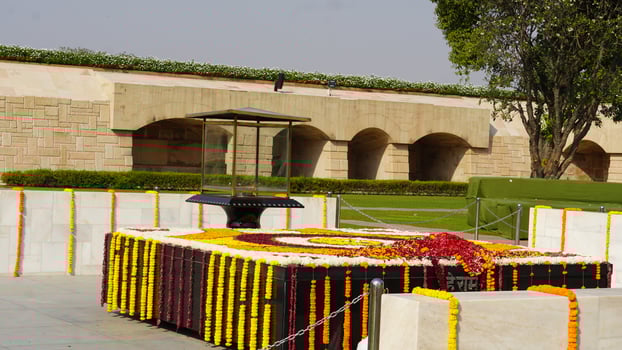 gandhi's memorial tomb stone in rajghat, delhi, india photo