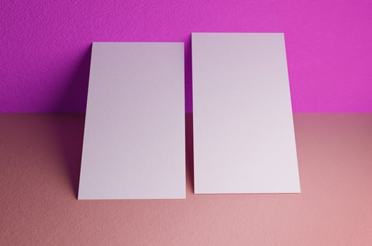 Double business card mockup leaning the wall photo
