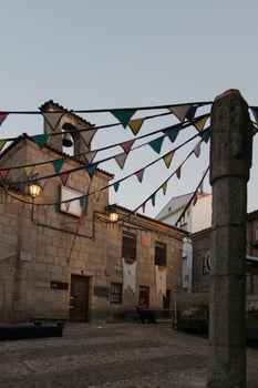 City hall of Belmonte and pelourinho pillar at sunset. Belmonte is a beautiful town at eastern Portugal with a jewish heritage. photo