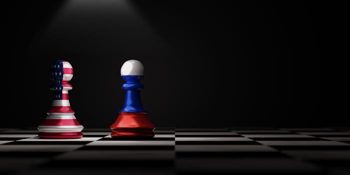 Pawn chess Battle between USA and Russia on chess board for political conflict and war concept by 3d rendering technique. photo