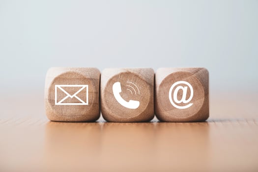 Customer service and business contact concept, wooden cube block which print screen letter , telephone email address and message. photo