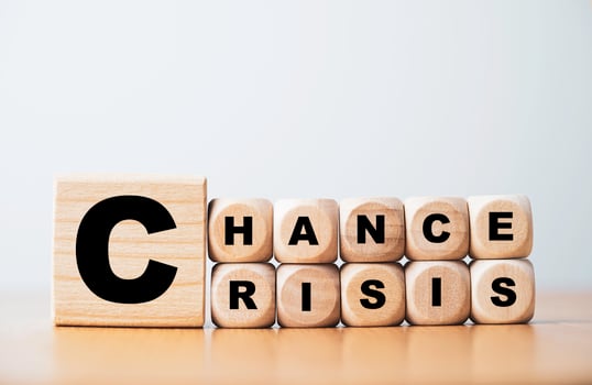 Chance and crisis wording print screen on wooden cube block for people positive and negative mindset in the same situation concept. photo