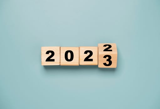 Wooden block cube flipping between 2022 to 2023 for change and preparation merry Christmas and happy new year. photo