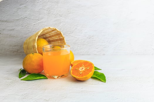 fresh orange juice with orange fruit in basket photo