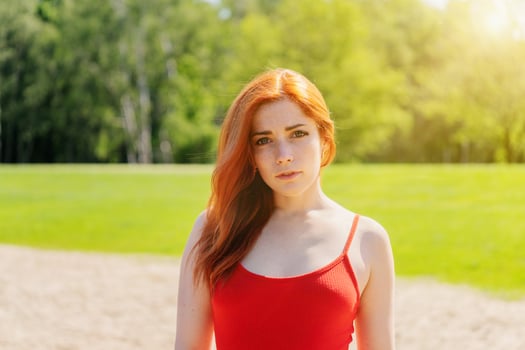 young woman outdoors on a bright sunny summer day photo