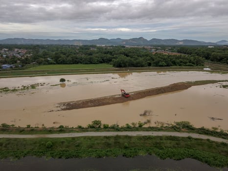 Flood at river near agricultural farm. photo