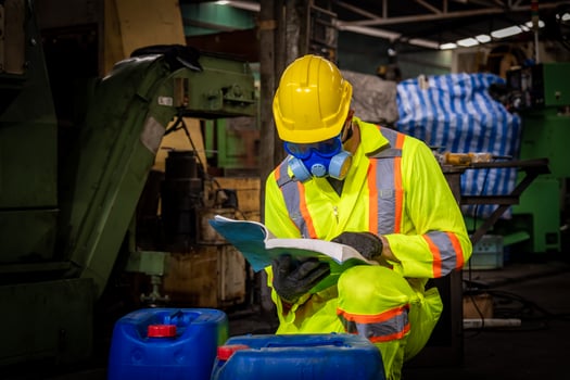 Engineer industry wearing safety uniform ,black gloves ,gas mask feel suffocate when under checking chemical tank in industry factory work. photo