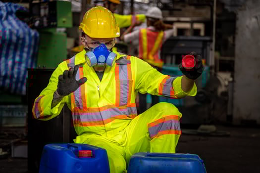 Engineer industry wearing safety uniform ,black gloves ,gas mask feel suffocate when under checking chemical tank in industry factory work. photo