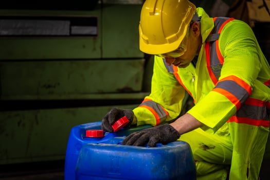 Engineer industry wearing safety uniform ,black gloves ,gas mask feel suffocate when under checking chemical tank in industry factory work. photo