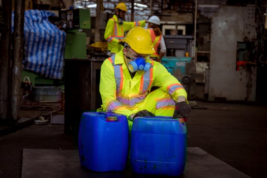 Engineer industry wearing safety uniform ,black gloves ,gas mask feel suffocate when under checking chemical tank in industry factory work. photo