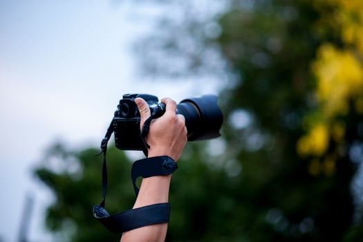 Hand photograph and photographic equipment of the photographer Concept photographer photo