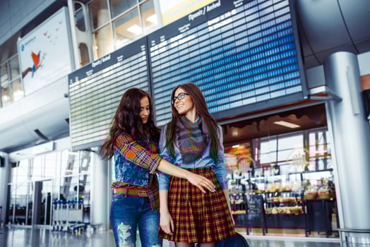 Two happy friends met at the airport.Art processing and retouchi photo