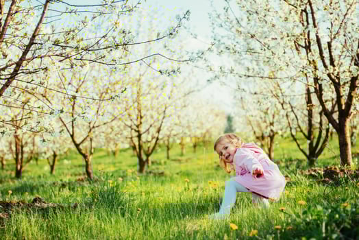 child running outdoors blossom trees. Art processing and retouch photo