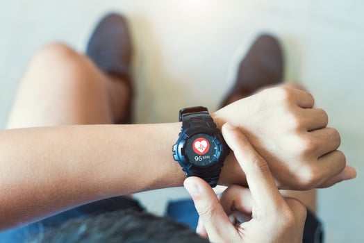 Close up white smart watch with icon Heart rate, healthcare concept. photo