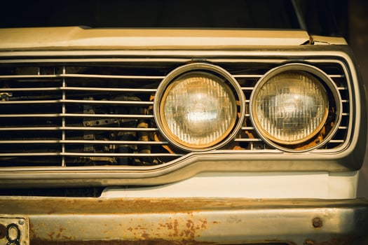 Close up headlight lamp of old classic car. photo