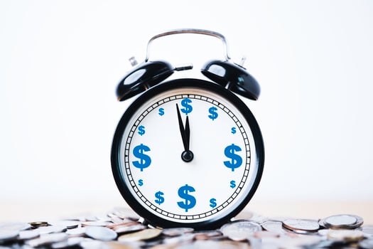 Dollar sign print screen inside alarm clock on heap of coins for time and money management concept. photo