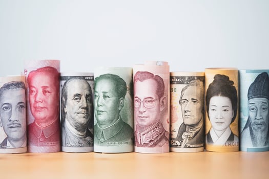 Multiple international currency of banknote on wooden table including baht dollar yuan won for money transfer and trading forex exchange concept. photo