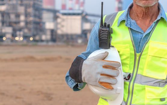 Senior engineers wearing gloves and helmets to work, Asian elders in safety work clothes. photo