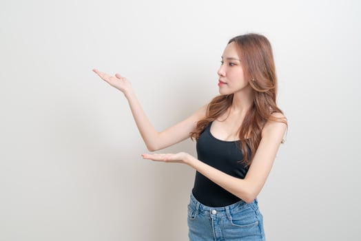 portrait beautiful woman with hand presenting or pointing photo