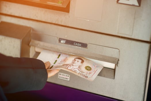 Press money in the bank's cash dispenser. Financial business concept With copy space photo