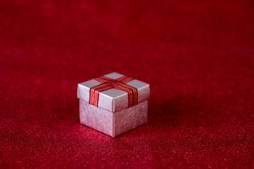 Red background image and gift box Valentine's Day concept photo