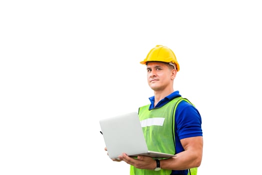 Worker man in hard hat and safety vest holding laptop with clipping path on white background photo