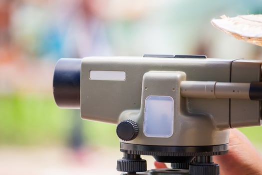 Surveyor equipment theodolite outdoors at construction site photo