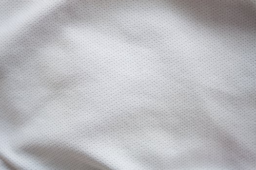 Close up shot of white textured football jersey photo