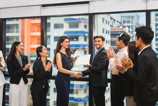 Employee gets a certificate of achievement, Businesspeople with certificate in the office, Businessman giving appreciation certificate to employee for achievement photo