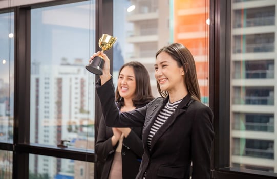 Business woman holding award trophy at meeting room, Celebration success happiness team concept photo