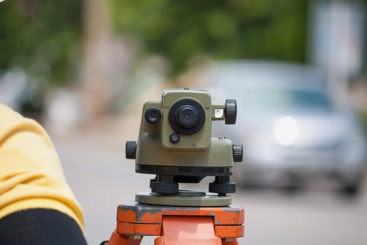 Surveyor equipment theodolite outdoors at construction site photo