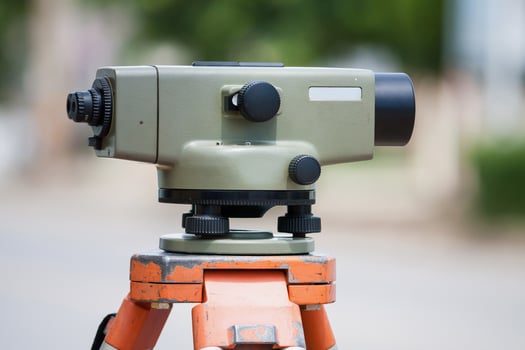 Surveyor equipment theodolite outdoors at construction site photo