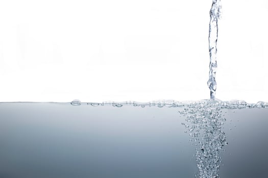 Water flow surface  with bubbles of air isolated white background. photo