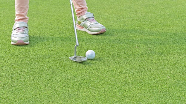 Golfers are about to play golf on bright green grass. photo