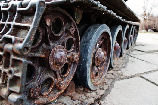 Detail shot with old vintage tank tracks and wheels. photo
