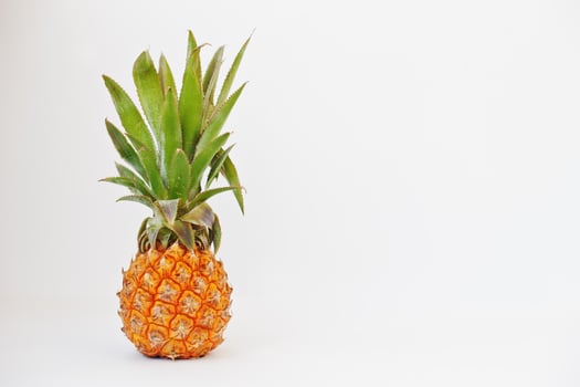 Exotic fruit baby pineapple isolated on white background. Healthy eating dieting food. photo