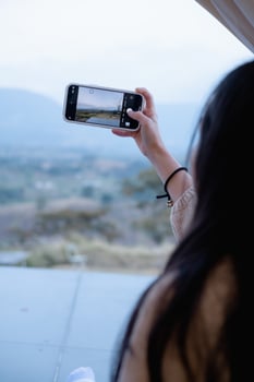 Woman using smartphone take a photo at Khao Kho, Thailand