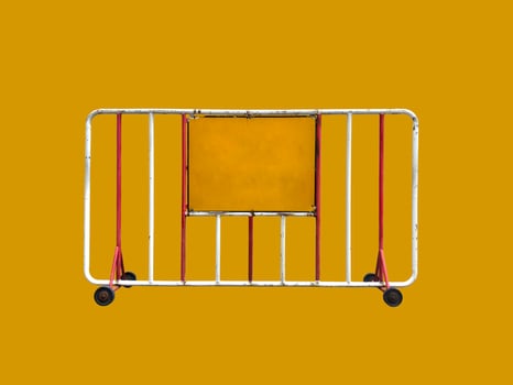 Old traffic steel fence with a wheel and yellow label on a yellow background with clipping path photo