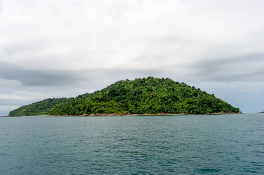 Sea water and beautiful green mountains photo