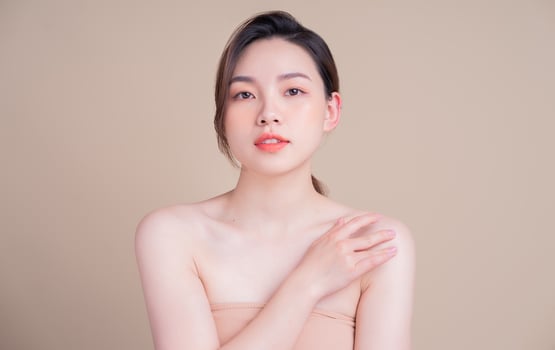 Attractive young Asian woman with fresh skin. Face care, facial treatment, , woman beauty skin isolated on white background. cosmetology, beauty skin and cosmetic concept photo