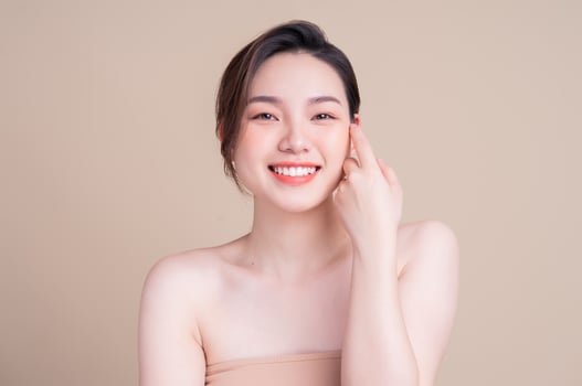 Attractive young Asian woman with fresh skin. Face care, facial treatment, , woman beauty skin isolated on white background. cosmetology, beauty skin and cosmetic concept photo