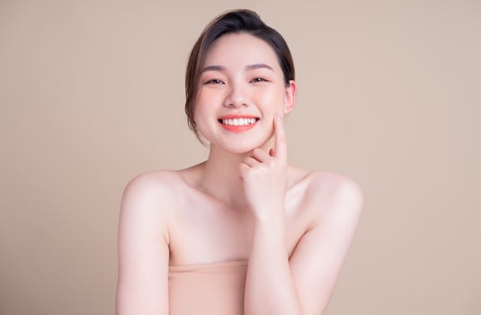 Attractive young Asian woman with fresh skin. Face care, facial treatment, , woman beauty skin isolated on white background. cosmetology, beauty skin and cosmetic concept photo