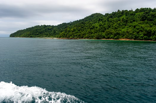 Sea water and beautiful green mountains photo