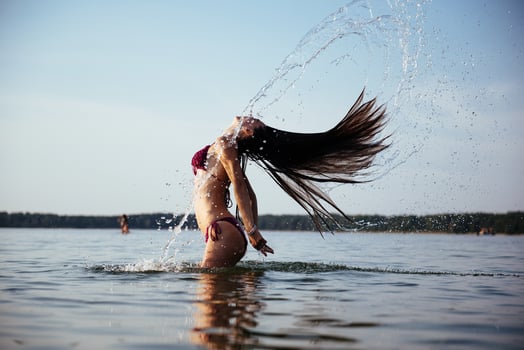 blonde woman on water background photo
