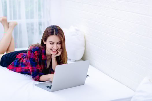 The woman and the computer in the white room Happy work The concept of happy working at home photo