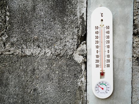Closeup thermometer showing temperature in degrees Celsius photo